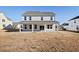 Two-story home featuring covered patio and expansive backyard at 65 Hickory Run Ln, Franklinton, NC 27525