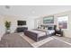 Spacious primary bedroom with soft carpet and a large bed with stylish decor at 65 Hickory Run Ln, Franklinton, NC 27525