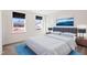 Cozy bedroom with a comfortable bed, side tables and a beautiful ocean artwork on the wall at 65 Hickory Run Ln, Franklinton, NC 27525