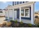 Inviting front porch with white columns and a well-maintained garden at 65 Hickory Run Ln, Franklinton, NC 27525
