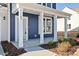 Close-up of the welcoming front porch with classic architectural details at 65 Hickory Run Ln, Franklinton, NC 27525