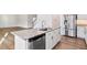 Modern kitchen with a center island featuring granite countertops and stainless steel appliances at 65 Hickory Run Ln, Franklinton, NC 27525