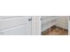 Walk-in pantry with white metal shelving and wood-look flooring at 65 Hickory Run Ln, Franklinton, NC 27525