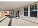 View of the covered patio with large windows and sliding glass door at 65 Hickory Run Ln, Franklinton, NC 27525