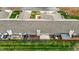 Aerial view of townhome with rear wood deck, fenced yard and manicured lawns at 653 Huntingdon St, Elon, NC 27244