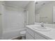 Standard bathroom with white fixtures, including a shower-tub combo and a single sink vanity at 653 Huntingdon St, Elon, NC 27244