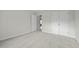 Carpeted bedroom with neutral paint and white trim and doors, creating a calming and inviting space at 653 Huntingdon St, Elon, NC 27244
