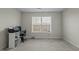 The carpeted bedroom has a window and would make a nice home office at 653 Huntingdon St, Elon, NC 27244