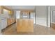 Efficient kitchen layout featuring light wood cabinets, a central island, and functional appliances at 653 Huntingdon St, Elon, NC 27244