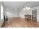 Sun-filled living room features hardwood floors at 653 Huntingdon St, Elon, NC 27244