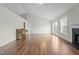 Large living room featuring hardwood floors, and fireplace at 653 Huntingdon St, Elon, NC 27244