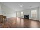 Spacious living room with vaulted ceilings, fireplace, and hardwood floors at 653 Huntingdon St, Elon, NC 27244