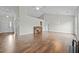 Open concept living room featuring hardwood floors and neutral colors at 653 Huntingdon St, Elon, NC 27244