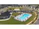 Aerial view of the community pool, playground, and parking areas, showcasing community amenities at 656 Dallas Rose Dr, Wendell, NC 27591