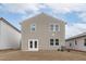 Exterior view shows a backyard with patio, well-maintained siding, and a view of neighboring houses at 656 Dallas Rose Dr, Wendell, NC 27591