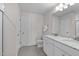 Well-lit bathroom featuring double vanities with granite countertops, modern fixtures, and a pristine, functional design at 656 Dallas Rose Dr, Wendell, NC 27591