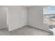 The carpeted room features a window with a view, a closet, and natural light at 656 Dallas Rose Dr, Wendell, NC 27591