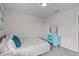 A serene bedroom with carpet features a bed and a light blue vanity table at 656 Dallas Rose Dr, Wendell, NC 27591