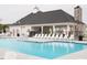 Community pool with lounge chairs and a covered patio, perfect for relaxing on sunny days at 656 Dallas Rose Dr, Wendell, NC 27591