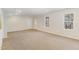 Finished basement area with carpet and windows for natural light at 7533 Silver View Ln, Raleigh, NC 27613