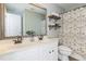 Bathroom with double sink vanity, and decorative shower curtain and shelves at 7533 Silver View Ln, Raleigh, NC 27613