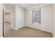 Clean bedroom with neutral colored walls, carpet flooring, one window and a closet at 7533 Silver View Ln, Raleigh, NC 27613