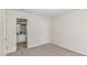 Cozy bedroom featuring plush carpeting and access to an ensuite bathroom at 7533 Silver View Ln, Raleigh, NC 27613