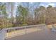 View from deck overlooking backyard surrounded by tall trees at 7533 Silver View Ln, Raleigh, NC 27613