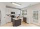 Modern kitchen featuring white cabinets, an island, stainless steel appliances, and tiled floors at 7533 Silver View Ln, Raleigh, NC 27613