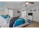 Comfortable bedroom featuring a ceiling fan, television, and plush rug for a cozy retreat at 805 N Elizabeth St St, Durham, NC 27701