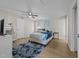 Bright bedroom featuring carpeted floors, a ceiling fan, and a comfortable sleeping space at 805 N Elizabeth St St, Durham, NC 27701
