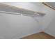 Bright closet featuring hanging rods for optimal storage space at 805 N Elizabeth St St, Durham, NC 27701