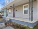 Charming home with a covered front porch, steps, and wrought iron supports at 805 N Elizabeth St St, Durham, NC 27701