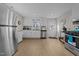 Bright kitchen with stainless steel appliances, white cabinets, and a practical layout at 805 N Elizabeth St St, Durham, NC 27701