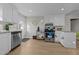 Well-lit kitchen with stainless steel appliances, white cabinetry, and granite countertops at 805 N Elizabeth St St, Durham, NC 27701