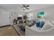 Inviting living room with neutral decor, ceiling fan, and ample natural light from multiple windows at 805 N Elizabeth St St, Durham, NC 27701