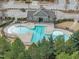 Community clubhouse with pool and pool, landscaping and parking at 8304 Rosiere Dr, Cary, NC 27518