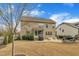 This spacious backyard features a built-in fire pit, patio, screened porch, and established landscaping at 8304 Rosiere Dr, Cary, NC 27518