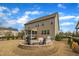 This spacious backyard has a built-in fire pit, a screened in patio, and professionally maintained landscaping at 8304 Rosiere Dr, Cary, NC 27518
