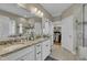 This primary bathroom features double sinks, granite countertops, and walk-in closet at 8304 Rosiere Dr, Cary, NC 27518