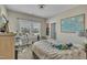 Bright bedroom with an inviting bed, desk by the window, and a decorative world map for an added touch at 8304 Rosiere Dr, Cary, NC 27518