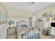 This bedroom is bright and cheerful and includes a decorative world map and a print of a famous Japanese woodblock at 8304 Rosiere Dr, Cary, NC 27518