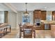 Lovely dining area with a wood table set and kitchen with stainless appliances in background at 8304 Rosiere Dr, Cary, NC 27518