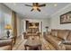 Bright living room with hardwood floors, comfortable seating, open floor plan, and lots of natural light at 8304 Rosiere Dr, Cary, NC 27518