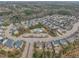 Aerial view of a neighborhood featuring lush landscaping, homes, and community amenities at 8304 Rosiere Dr, Cary, NC 27518