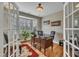 Cozy office space with hardwood floors, bay window, and an elegant lighting fixture at 8304 Rosiere Dr, Cary, NC 27518