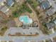 Aerial view of a neighborhood pool with recreational areas, parking, and sidewalks at 8304 Rosiere Dr, Cary, NC 27518