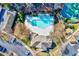 An aerial view of the community pool, tennis court, and clubhouse at 833 Providence Glen Dr, Chapel Hill, NC 27514
