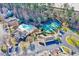 Aerial view showcasing the pool, clubhouse, tennis court and parking area at 833 Providence Glen Dr, Chapel Hill, NC 27514