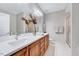 Bright bathroom featuring double sinks, quartz countertops and modern fixtures at 833 Providence Glen Dr, Chapel Hill, NC 27514